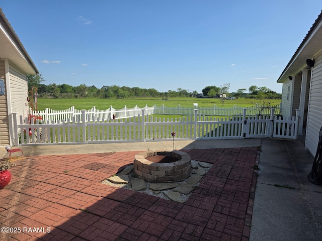 168 Birdhaven Rd, Rayne, LA 70578 - view of patio / terrace with a fire pit and a rural view