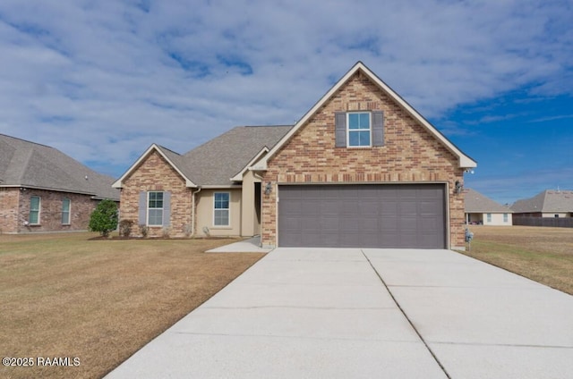 view of front of home featuring a garage and a front lawn