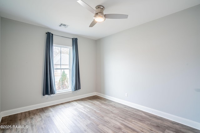 spare room with ceiling fan and light hardwood / wood-style flooring