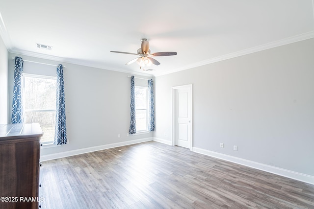 spare room featuring crown molding, ceiling fan, and hardwood / wood-style floors