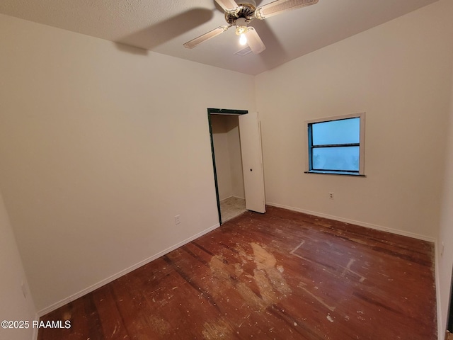 unfurnished bedroom with dark wood-type flooring and ceiling fan