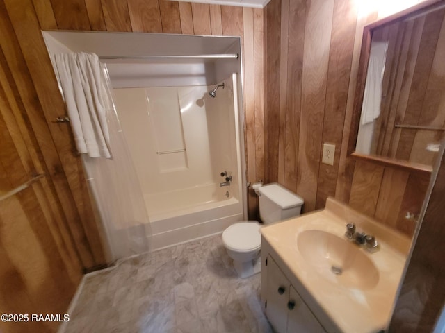 full bathroom with vanity, bathtub / shower combination, toilet, and wood walls