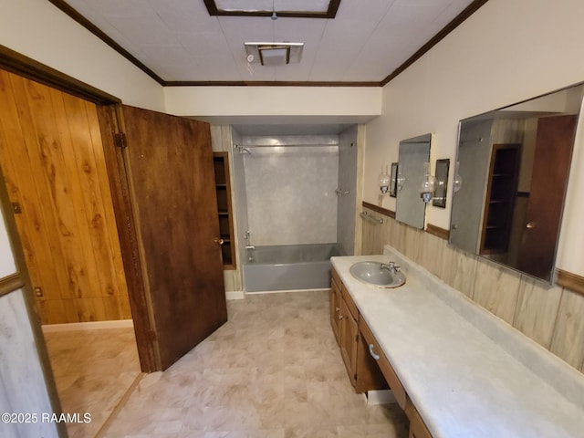 bathroom featuring ornamental molding, washtub / shower combination, vanity, and wooden walls