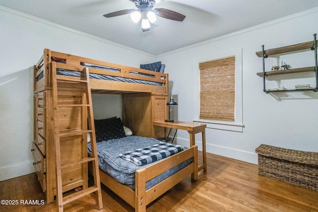 bedroom with ornamental molding and wood-type flooring