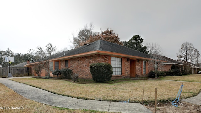 single story home with a front yard