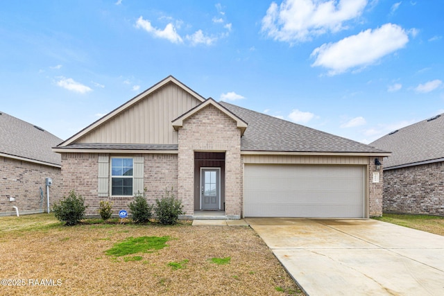 view of front of home featuring a garage and a front yard