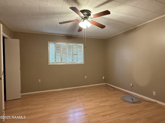 unfurnished room with crown molding, ceiling fan, and light hardwood / wood-style floors