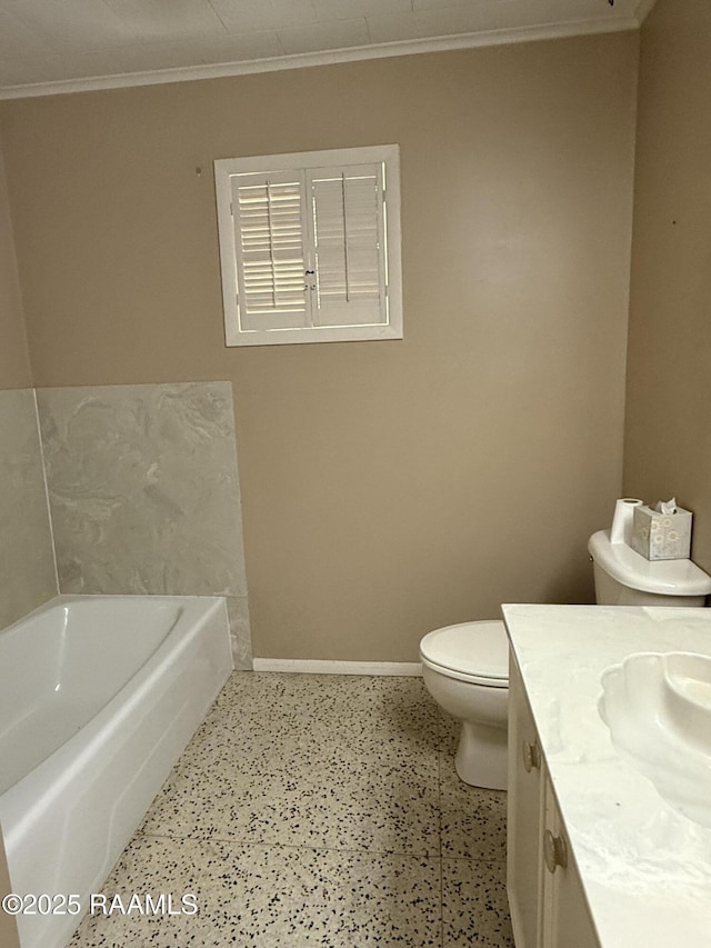 bathroom featuring crown molding, vanity, a bath, and toilet