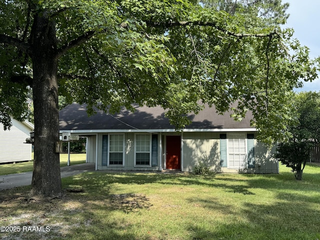 ranch-style home featuring a front yard and a carport