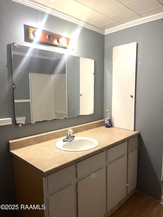 bathroom featuring vanity and ornamental molding