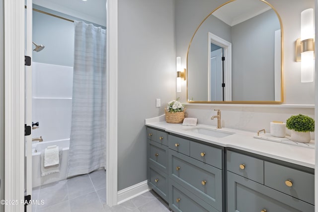 full bathroom with shower / bath combo with shower curtain, vanity, baseboards, and tile patterned floors