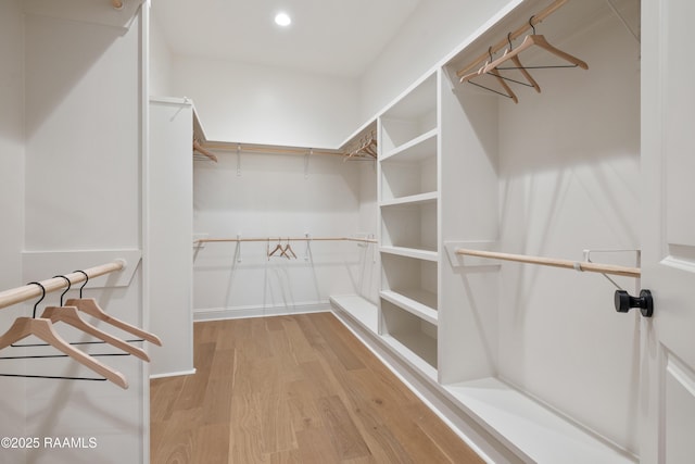 walk in closet featuring light wood-style flooring