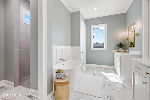 bathroom with marble finish floor, plenty of natural light, vanity, and crown molding