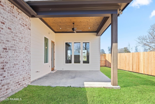 view of patio / terrace with ceiling fan and fence