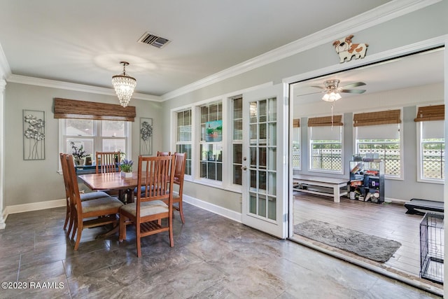 dining space with ornamental molding, plenty of natural light, and ceiling fan with notable chandelier