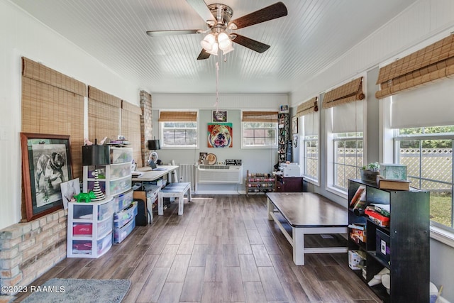 interior space with ceiling fan