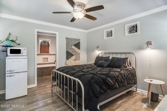 bedroom with ceiling fan, ornamental molding, connected bathroom, and hardwood / wood-style floors