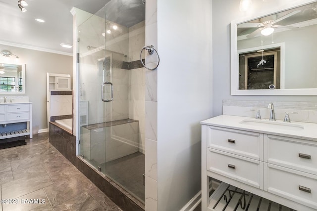 bathroom with ceiling fan, ornamental molding, shower with separate bathtub, and vanity