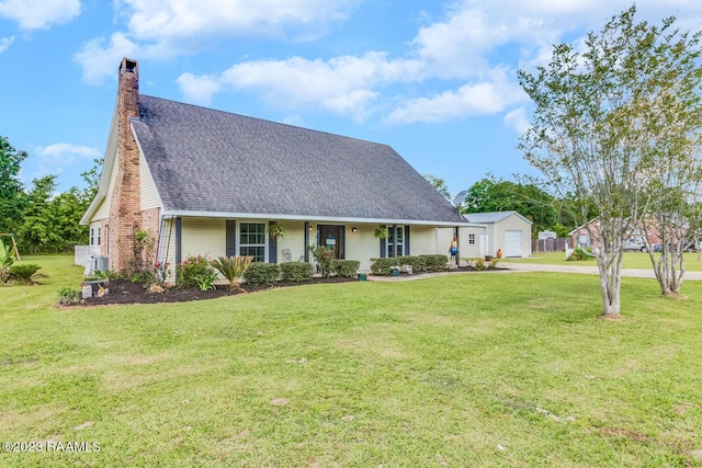 view of front of property with a garage and a front yard