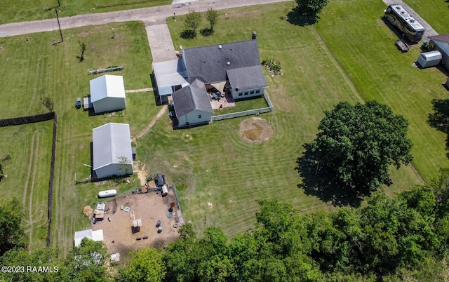 birds eye view of property with a rural view