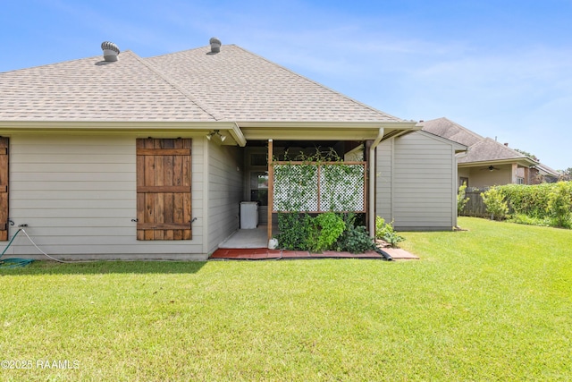 rear view of house with a lawn