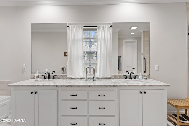 bathroom featuring vanity and crown molding