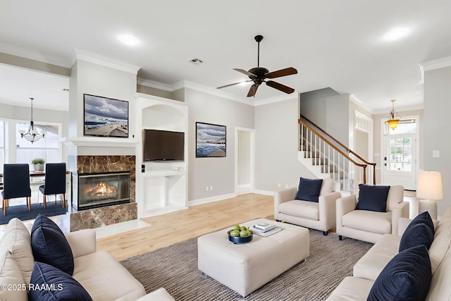 110 Yorkshire Cir, Lafayette, LA 70508 - living room with light wood-style floors, stairway, ornamental molding, ceiling fan, and baseboards