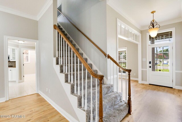 110 Yorkshire Cir, Lafayette, LA 70508 - entryway featuring crown molding, light wood-type flooring, stairway, and baseboards
