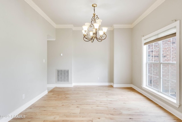 110 Yorkshire Cir, Lafayette, LA 70508 - spare room featuring a chandelier, ornamental molding, light wood-style floors, and baseboards