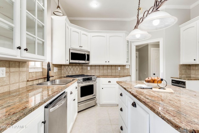 110 Yorkshire Cir, Lafayette, LA 70508 - kitchen featuring appliances with stainless steel finishes, a sink, white cabinetry, glass insert cabinets, and crown molding