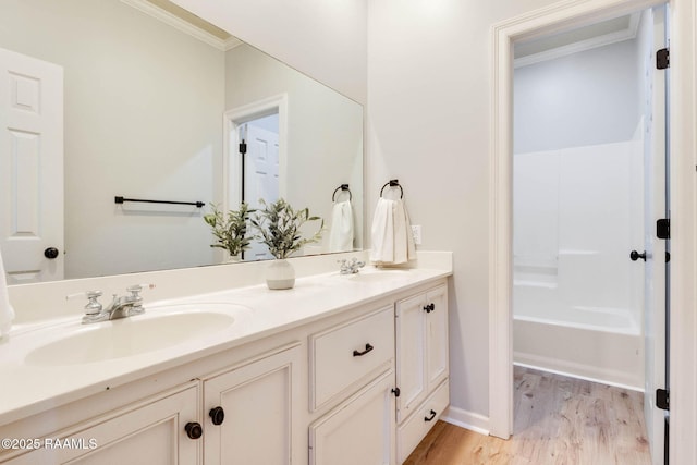 110 Yorkshire Cir, Lafayette, LA 70508 - full bathroom with ornamental molding, double vanity, wood finished floors, and baseboards
