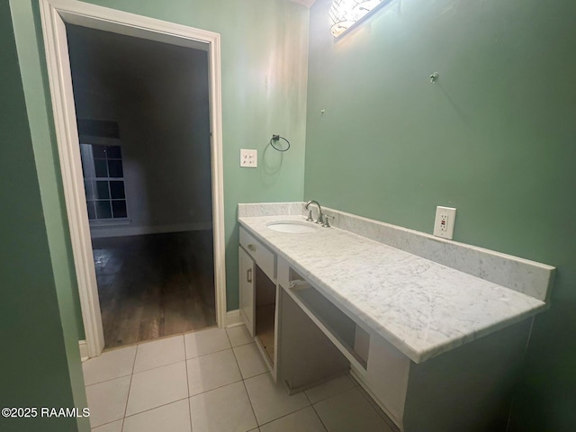 bathroom with tile patterned flooring and vanity