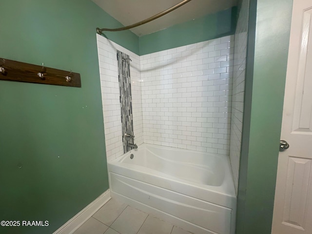 bathroom with tile patterned floors and tiled shower / bath