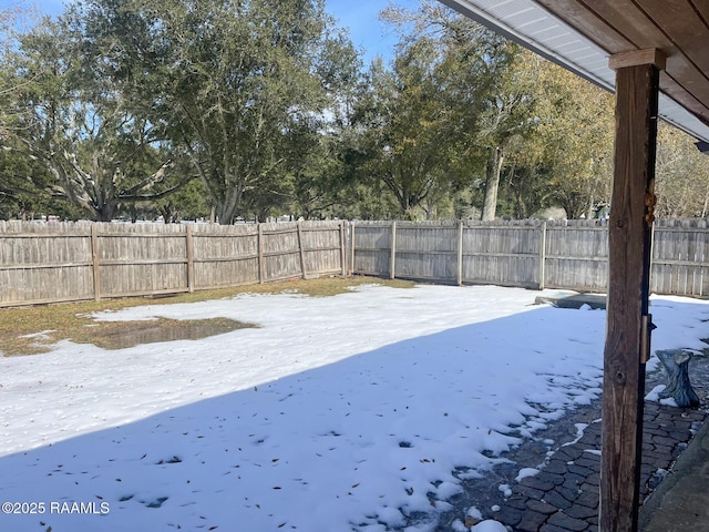 view of yard layered in snow