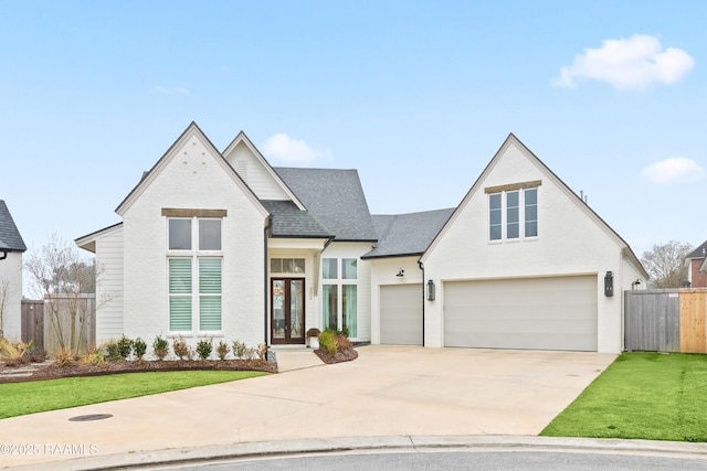 view of front of house featuring a garage and a front yard