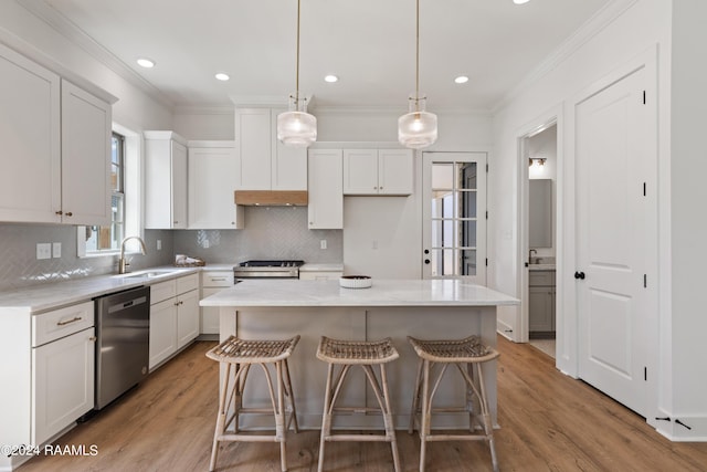 kitchen with sink, white cabinetry, range, a center island, and stainless steel dishwasher