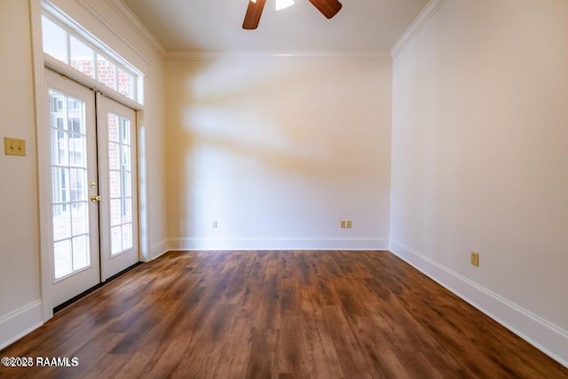 spare room featuring french doors, ornamental molding, and dark hardwood / wood-style floors