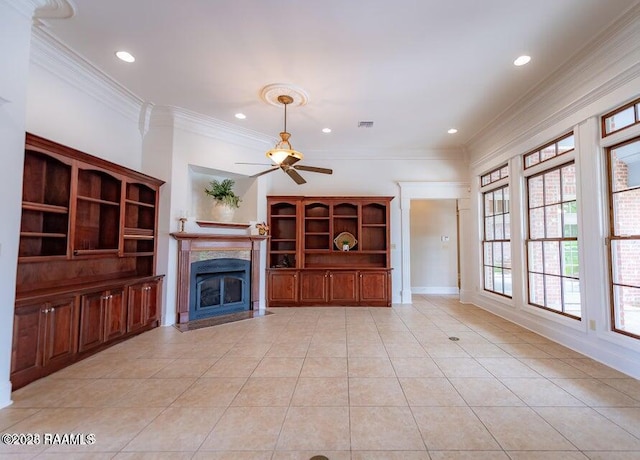 unfurnished living room featuring ceiling fan, ornamental molding, a high end fireplace, and light tile patterned floors