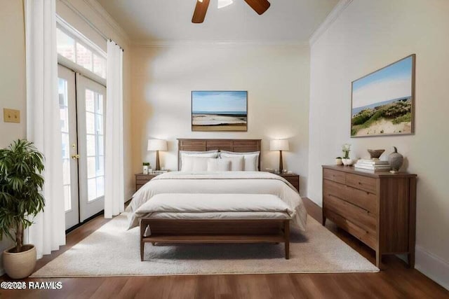 bedroom with french doors, ceiling fan, wood-type flooring, and crown molding