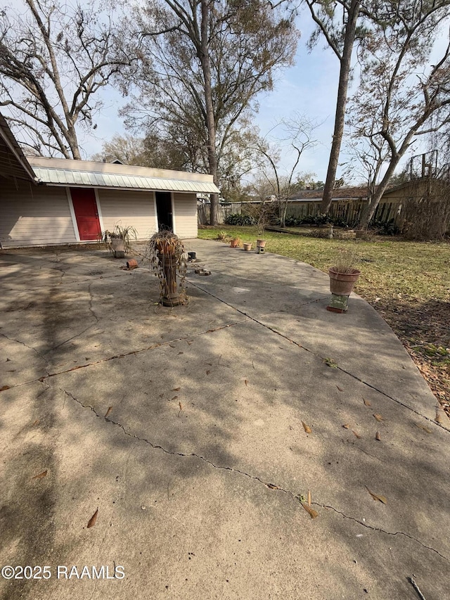 view of side of property featuring a patio area