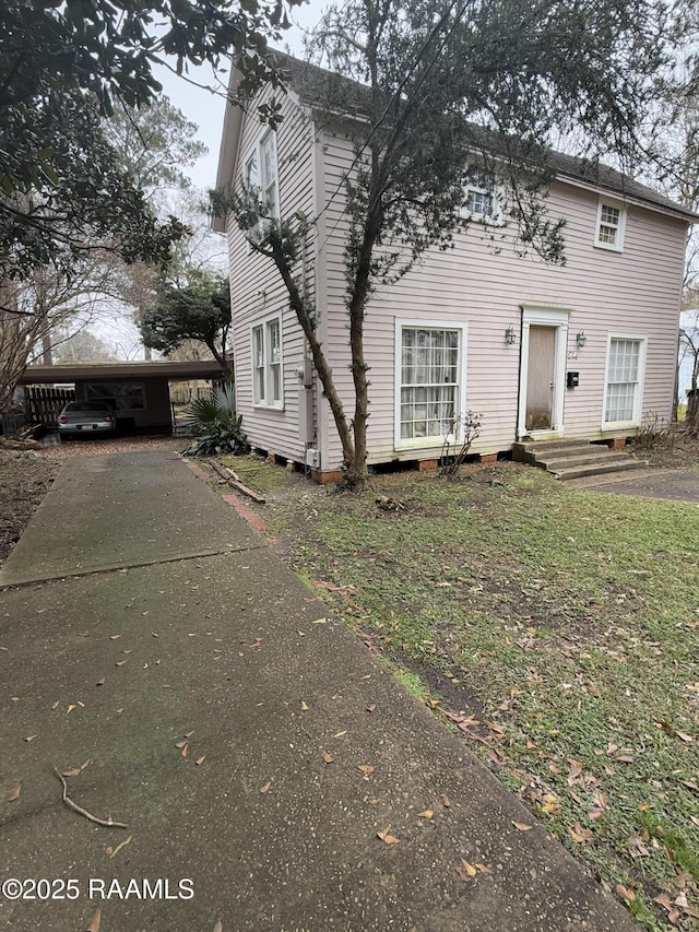 view of front of home with a carport