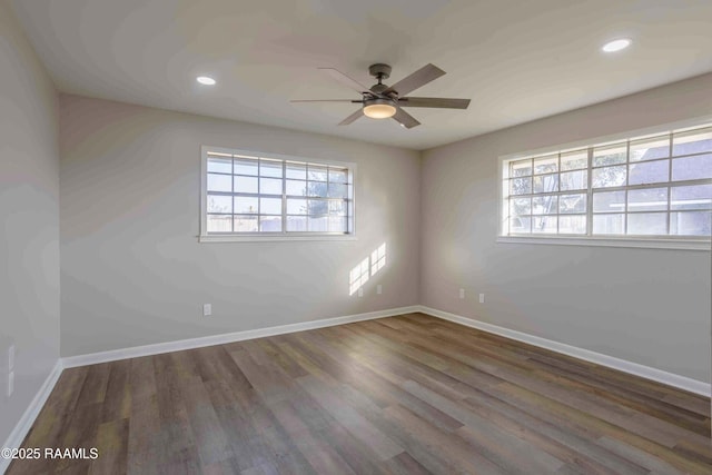 unfurnished room featuring dark hardwood / wood-style floors and ceiling fan