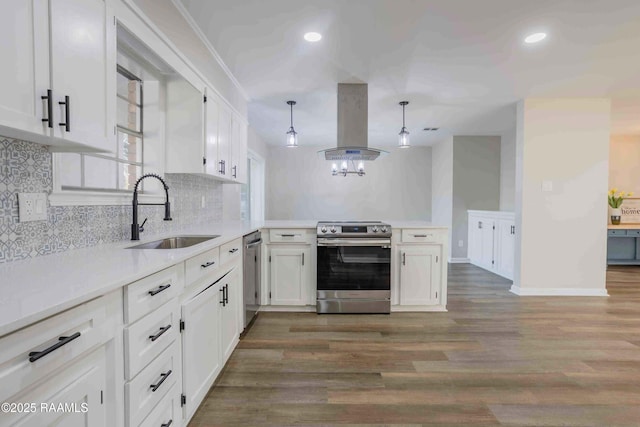 kitchen with pendant lighting, sink, white cabinets, island exhaust hood, and stainless steel appliances