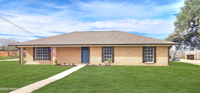 ranch-style home with a front yard