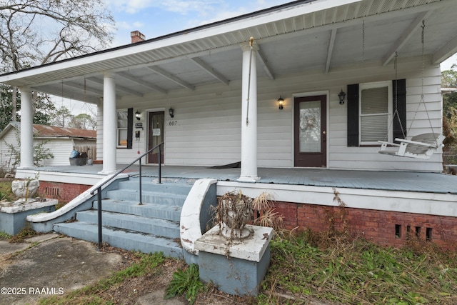 property entrance with a porch