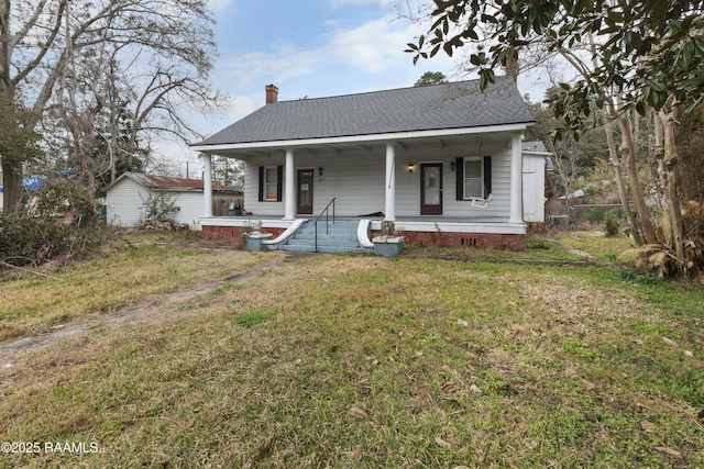 view of front of home with a front yard and a porch