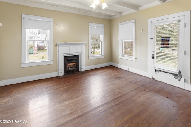 unfurnished living room featuring beamed ceiling, ceiling fan, and wood-type flooring