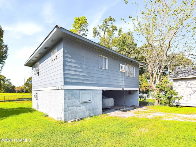 back of property with a lawn