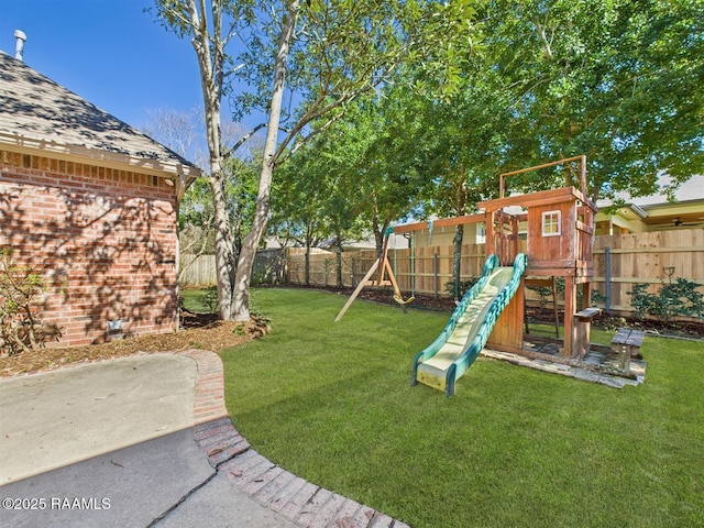 view of jungle gym with a lawn and a fenced backyard