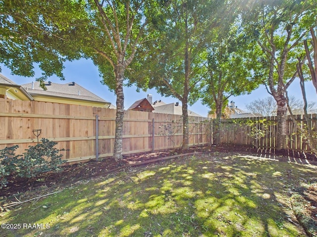 view of yard featuring a fenced backyard